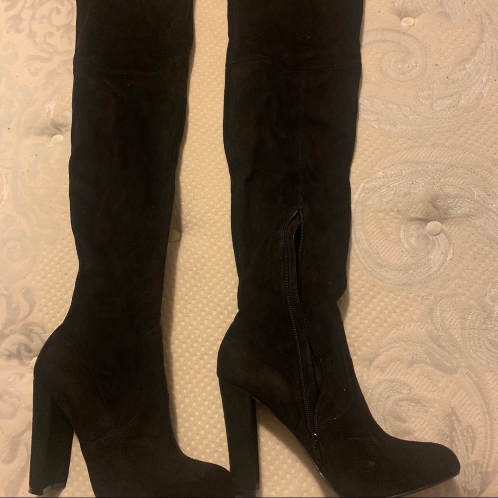 Black knee high boots.
